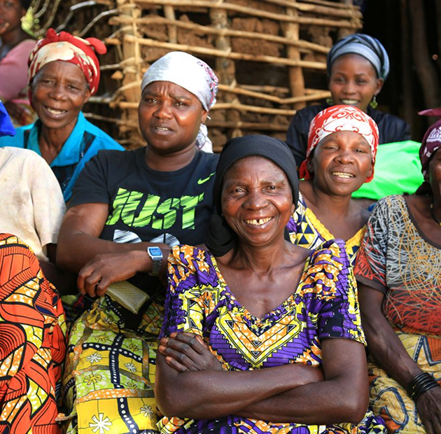 Group of women smiling together, representing the Widows Ministry